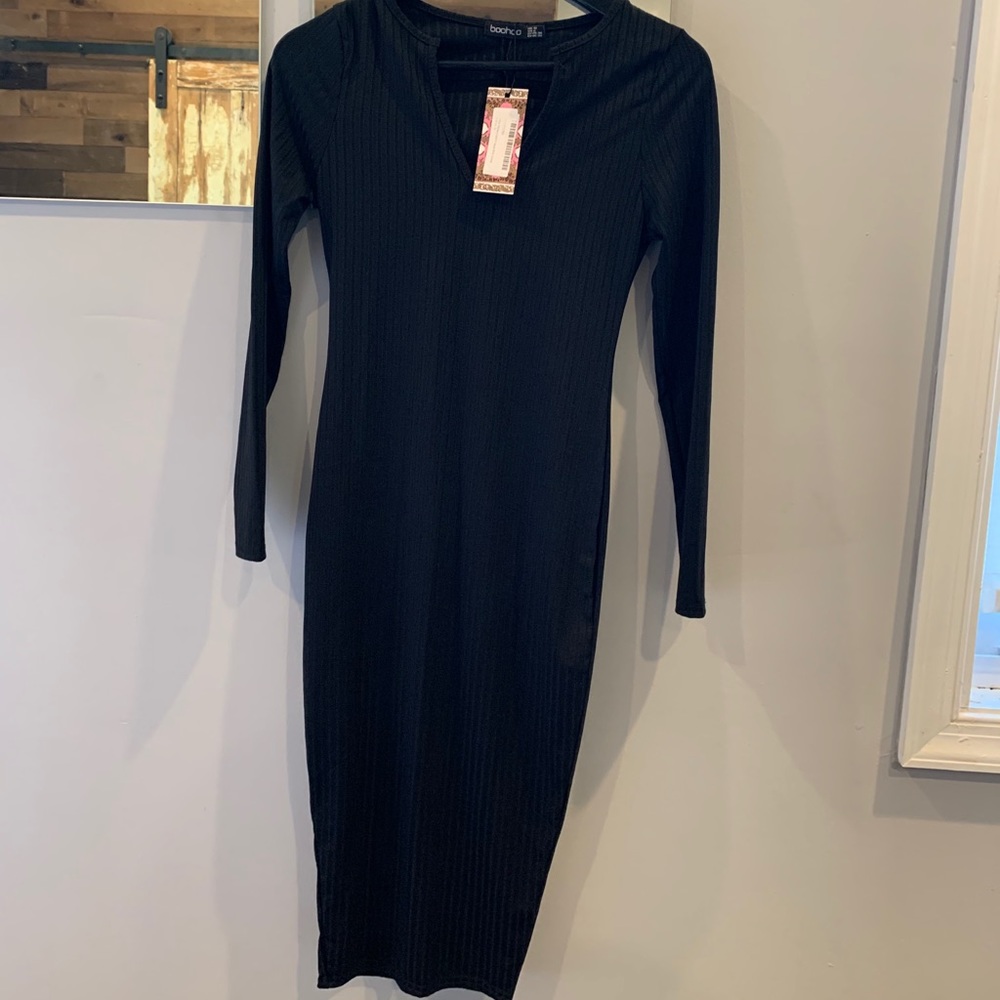 NWT black sporty dress. Size 6 on tag. Ribbed look